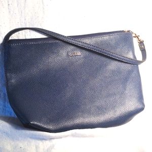 Guess hand bag with leopard interior.Cute little navy blue bag